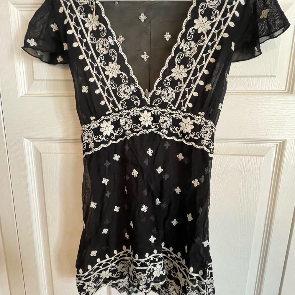 Sheer cap sleeve top.